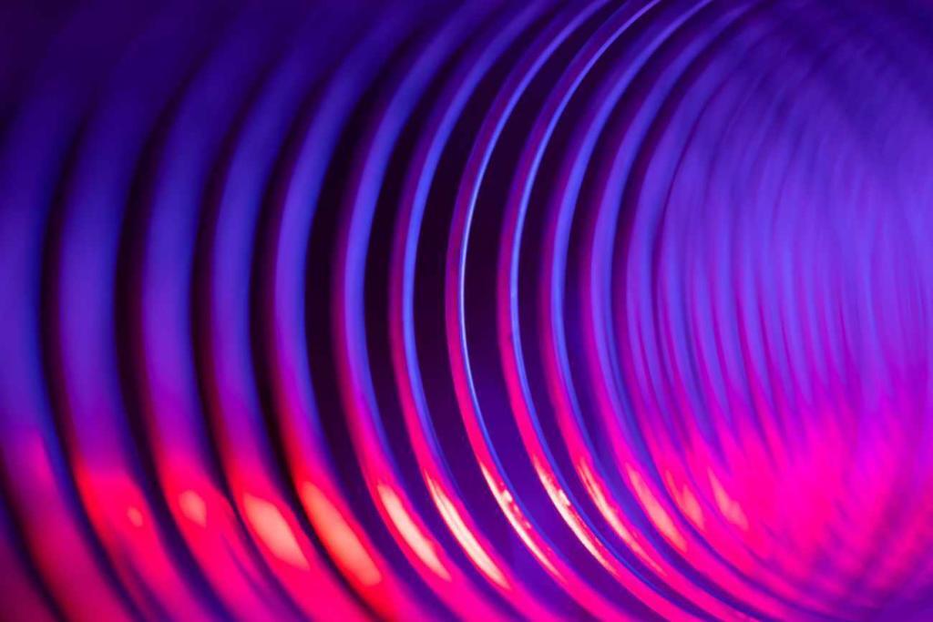 We see the inside of a purple-tinted spring where energy flows down the barrel.