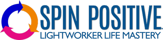 TO THE LEFT IS A CIRCLE OF THREE ARROWS ALL POINTING CLOCKWISE, THE FIRST ON THE LEFT IS MEDIUM BLUE, THE NEXT IS TANGERINE ORANGE, THE FINAL ARROW TOWARD THE BOTTOM IS MAGENTA PINK. TO THE RIGHT OF THE ARROWS ARE TWO ROWS OF WORDS. THE FIRST ROW, IN LARGER TYPEFACE ARE THE WORDS SPIN POSITIVE IN SAPPHIRE BLUE. UNDER THOSE WORDS ARE FOUND "LIGHTWORKER LIFE MASTERY" IN A MORE ELEGANT TYPEFACE, BUT THE SAME BLUE COLOR.