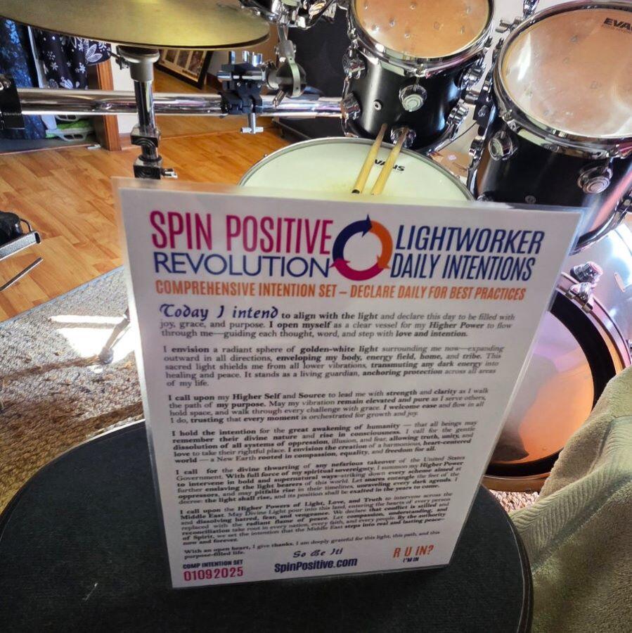 Here we see a laminated intention set sitting on a drum throne behind a green drum set.